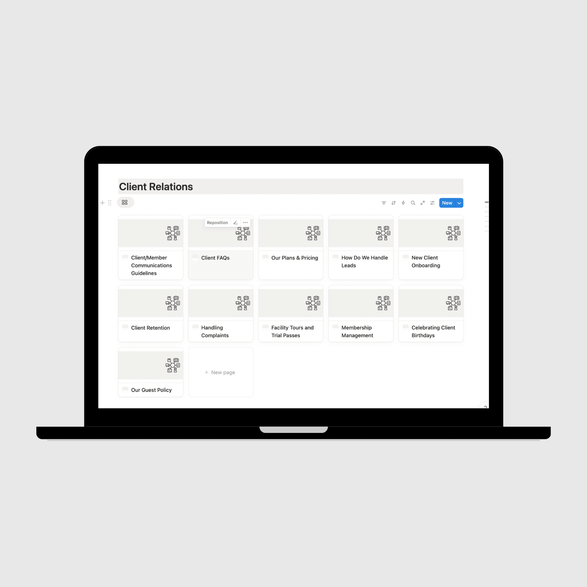 Laptop displaying a digital manual on a light gray background