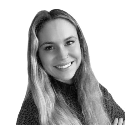Black and white portrait of a woman with long hair against a plain background